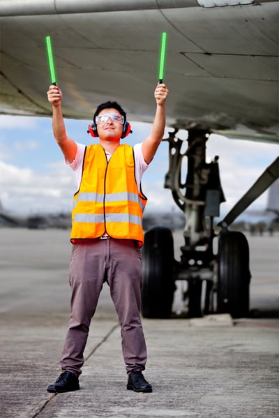 Air traffic controller holding light signs at the airport-1